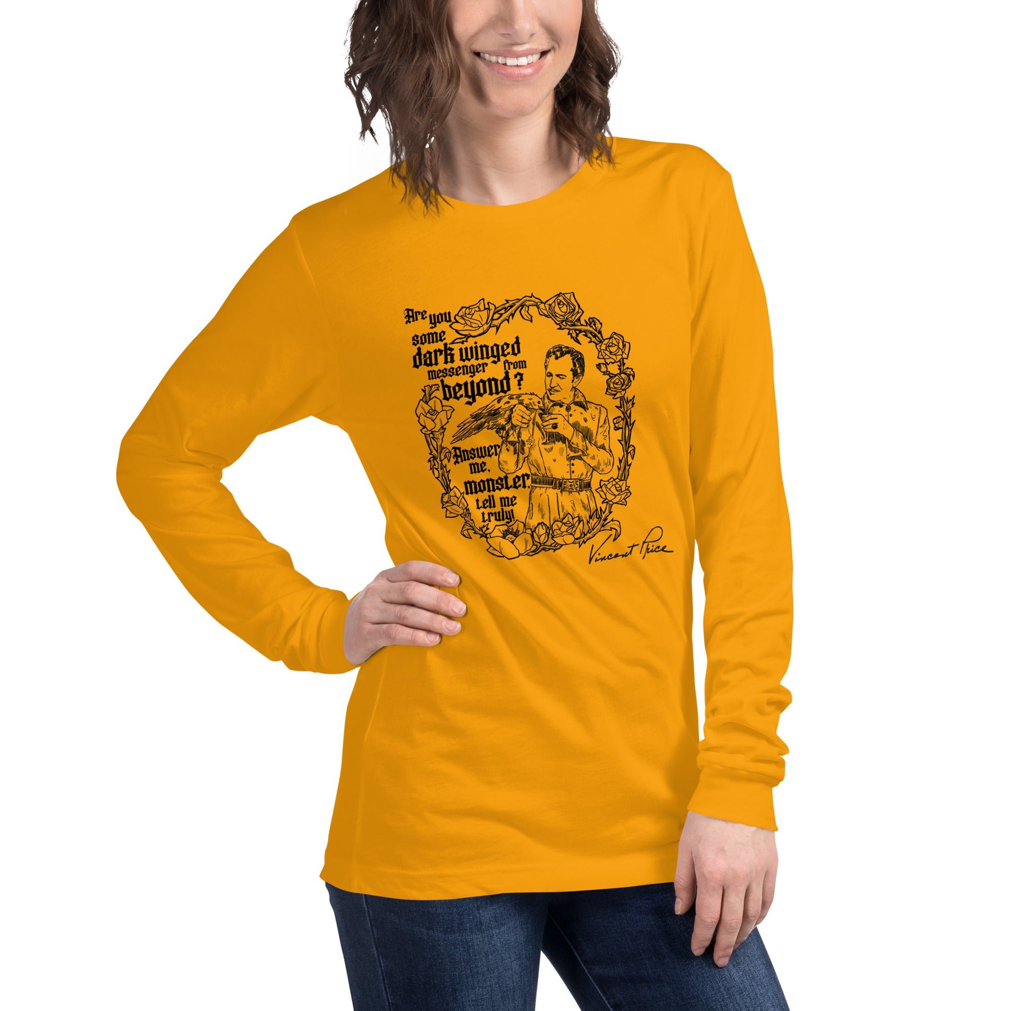 Person wearing a yellow long-sleeve shirt with graphic design and text.