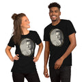 Two people wearing black t-shirts with a graphic of a man's face on a white background