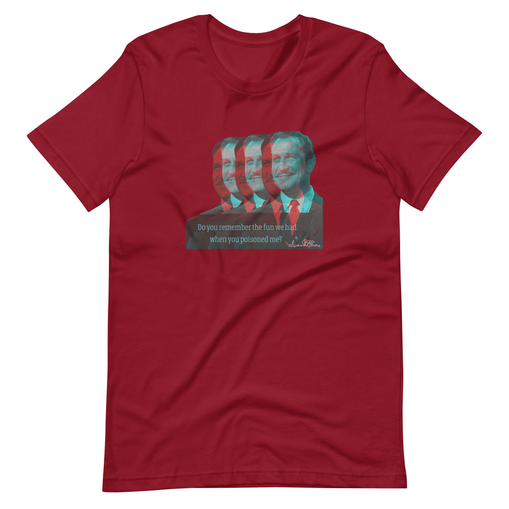 Red t-shirt with a graphic of a man's face and text on a white background