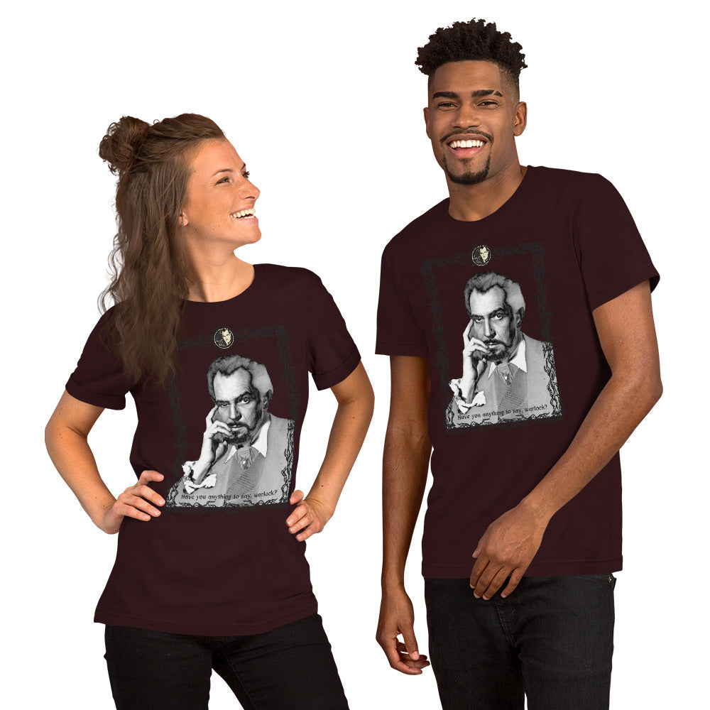 A man and a woman smiling, wearing a dark red t-shirt with a grayscale illustration of a person in the center.